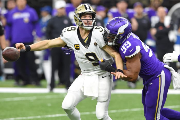 Jan 5, 2020; New Orleans, Louisiana, USA; New Orleans Saints quarterback Drew Brees (9) fumbles the ball as he is hit by Minnesota Vikings defensive end Danielle Hunter (99) during the fourth quarter of a NFC Wild Card playoff football game at the Mercedes-Benz Superdome. Mandatory Credit: John David Mercer-USA TODAY Sports